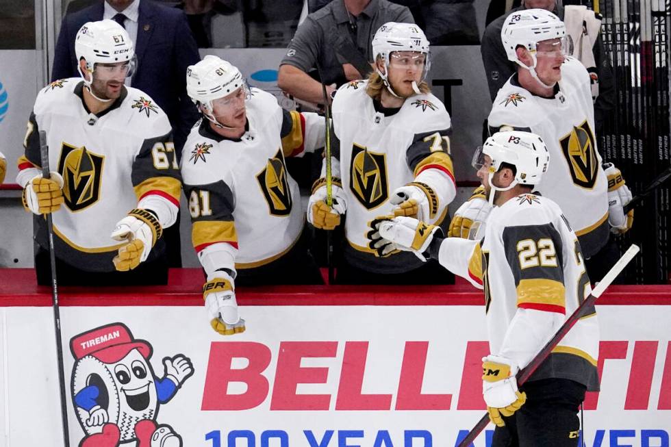 Vegas Golden Knights center Michael Amadio (22) celebrates with teammates after scoring a goal ...