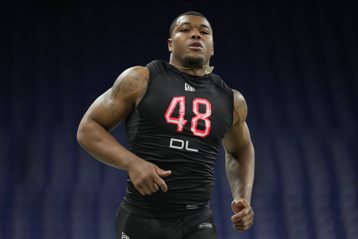 Georgia defensive lineman Travon Walker runs the 40-yard dash at the NFL football scouting comb ...