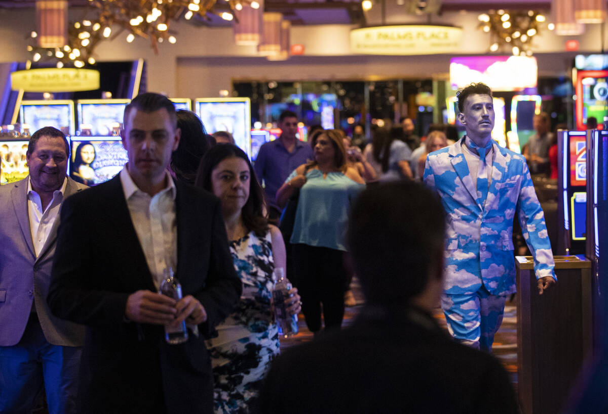 Guests walk the casino floor during the reopening party at the Palms on Wednesday, April 27, 20 ...