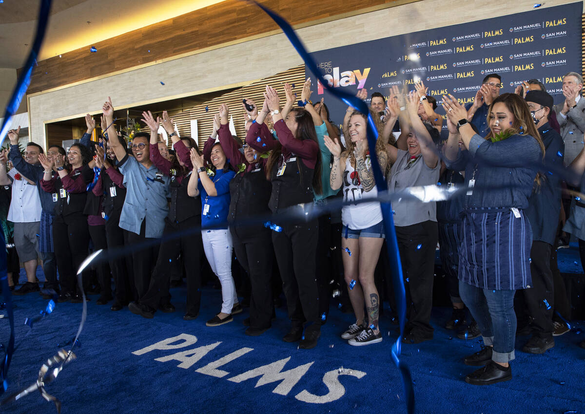 Employees who have worked at the Palms since its original opening in 2001 cheer during the reop ...