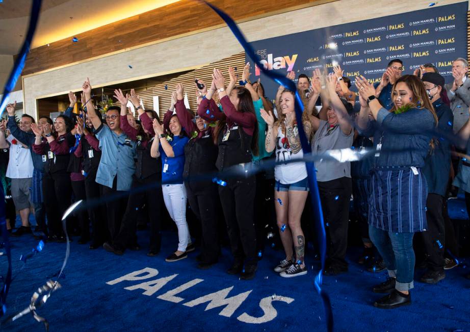 Employees who have worked at the Palms since its original opening in 2001 cheer during the reop ...