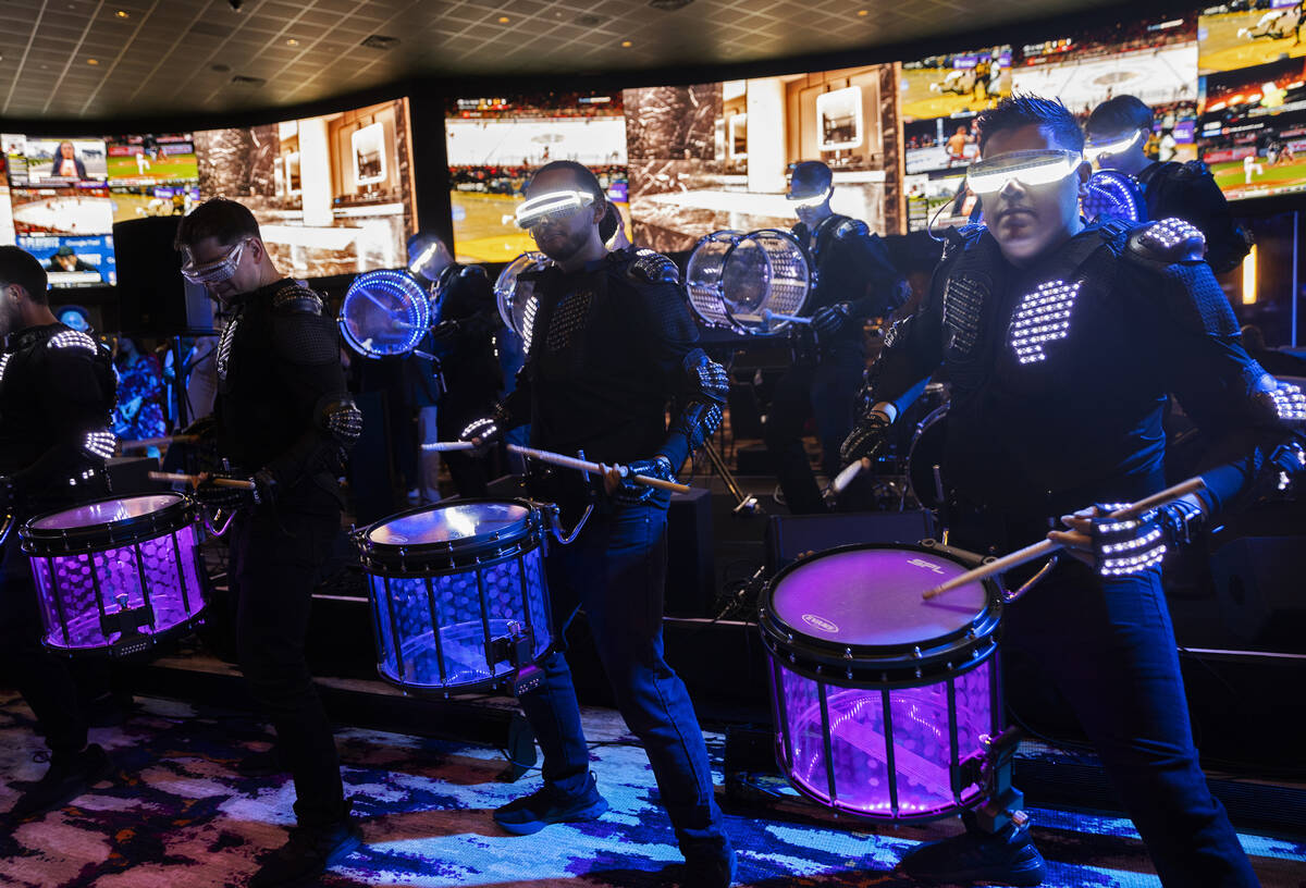 The Vegas Golden Knights Drumbots drumline performs during the pre-opening party at the Palms o ...
