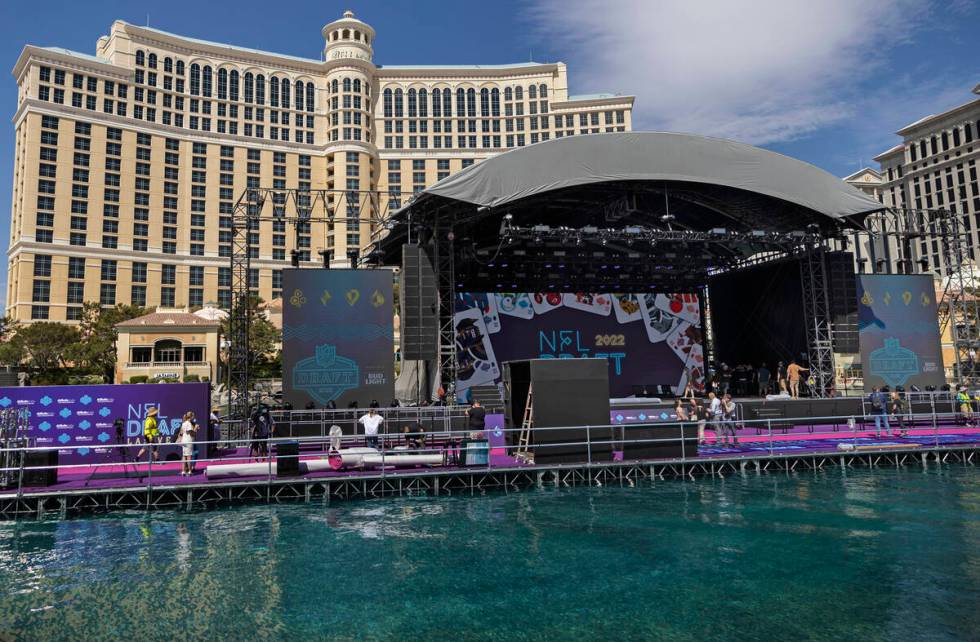 Workers continue to build the NFL Draft Red Carpet Stage at the Bellagio Fountains on Tuesday, ...