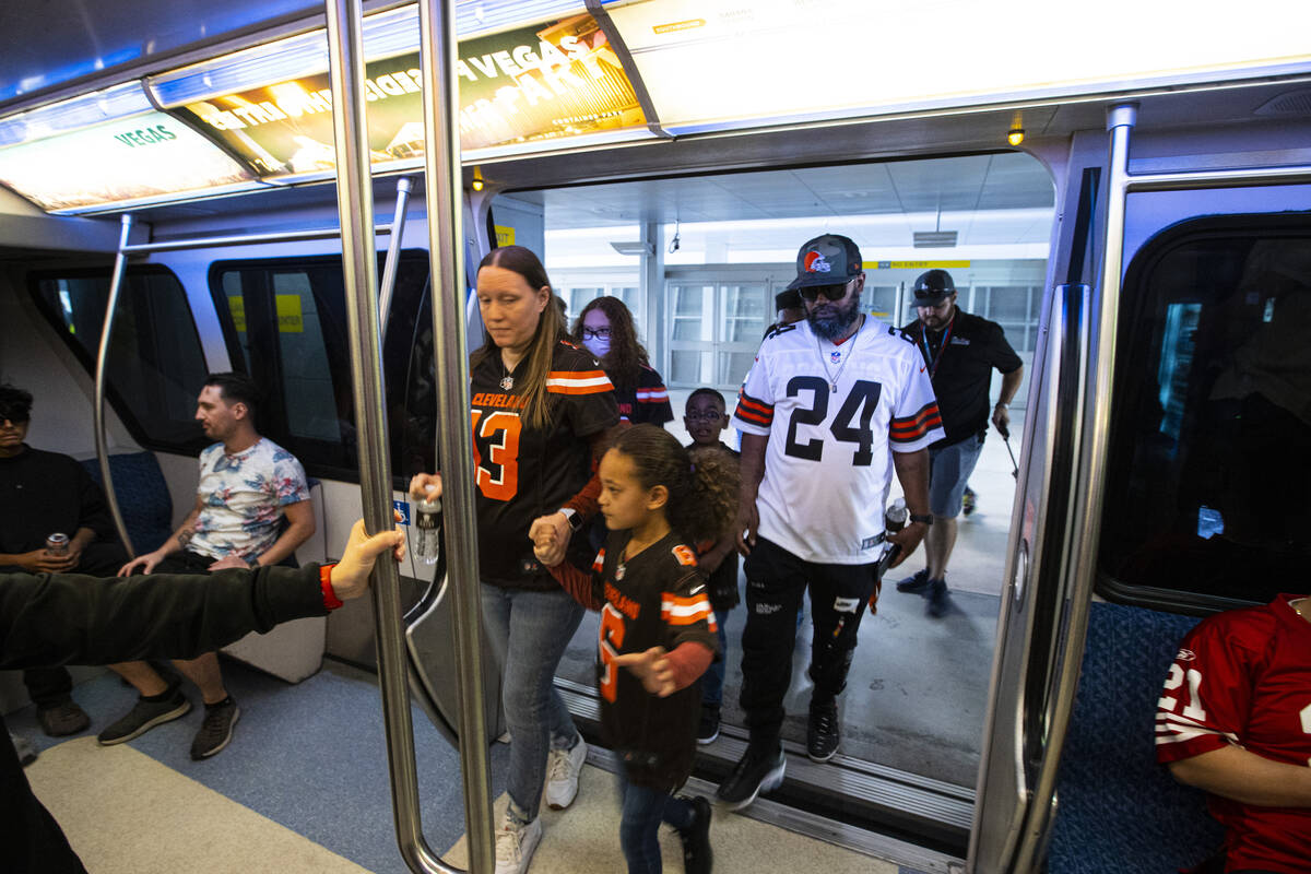 The Thomas family, Cleveland Browns fans from Las Vegas, make their way onto the Las Vegas Mono ...