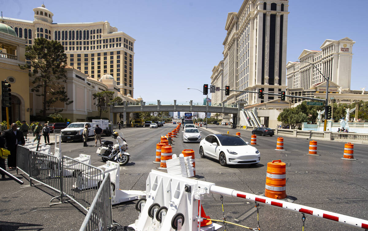 Vehicles pass by the intersection of Las Vegas Boulevard and Flamingo Road during the first day ...