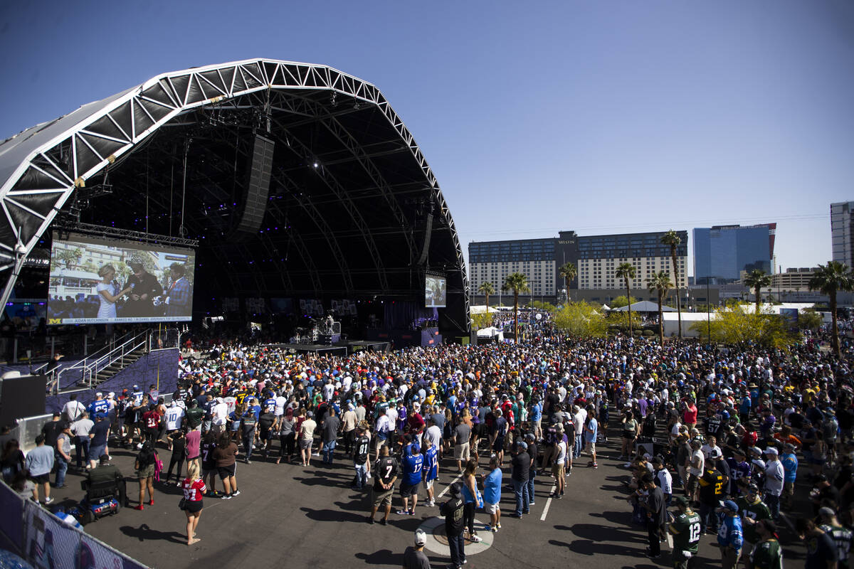 People attend the NFL Draft event in Las Vegas, Thursday, April 28, 2022. (Erik Verduzco / Las ...