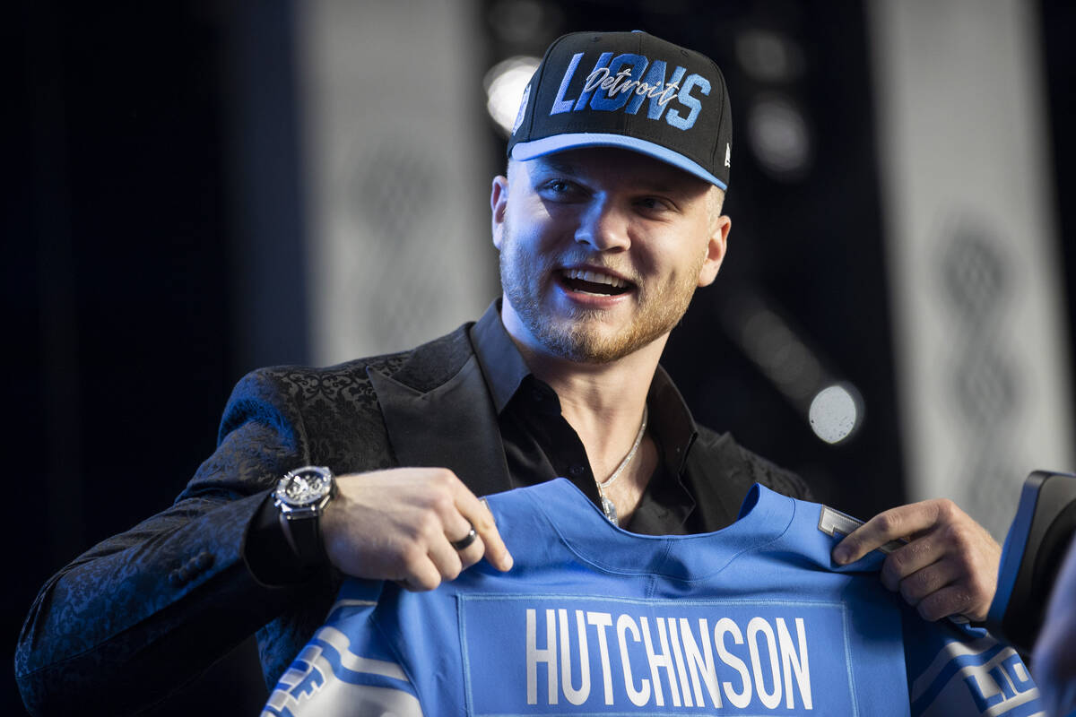 Aidan Hutchinson poses on stage after the Detroit Lions selected him as the second pick in the ...