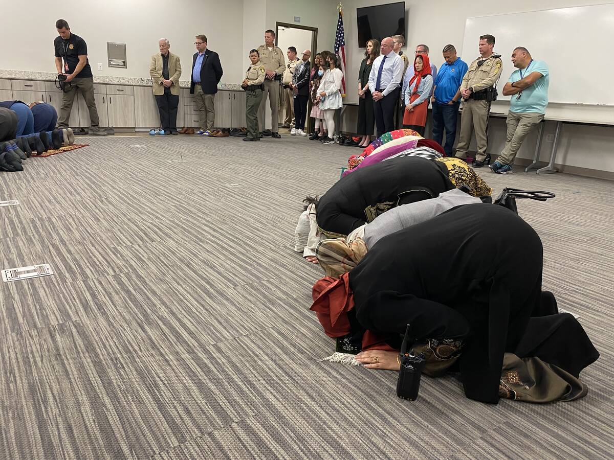 Members of the Muslim community pray inside Metro's Summerlin station on Wednesday, April 27, 2 ...