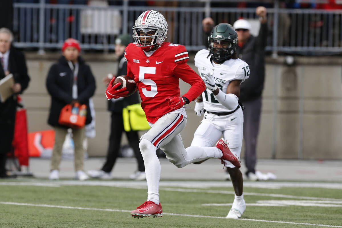 Ohio State receiver Garrett Wilson plays against Michigan State during an NCAA college football ...