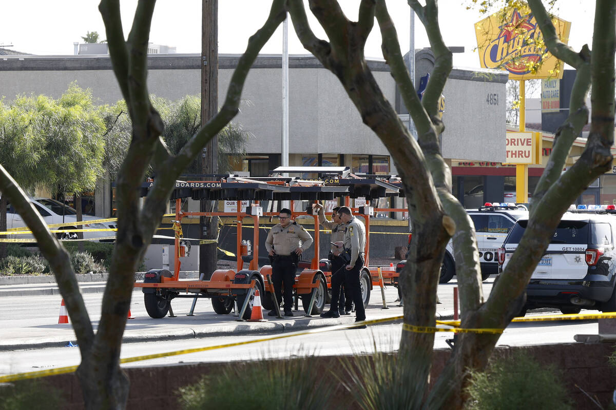 Las Vegas police investigate a shooting near the intersection of Decatur and Charleston bouleva ...