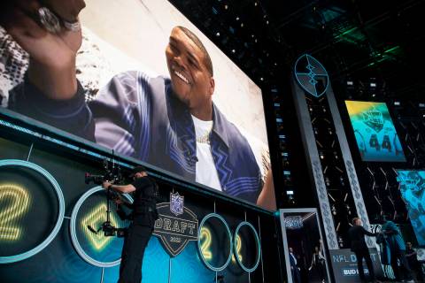 NFL Commissioner Roger Goodell, left, holds a Jacksonville Jaguars jersey after announcing Trav ...