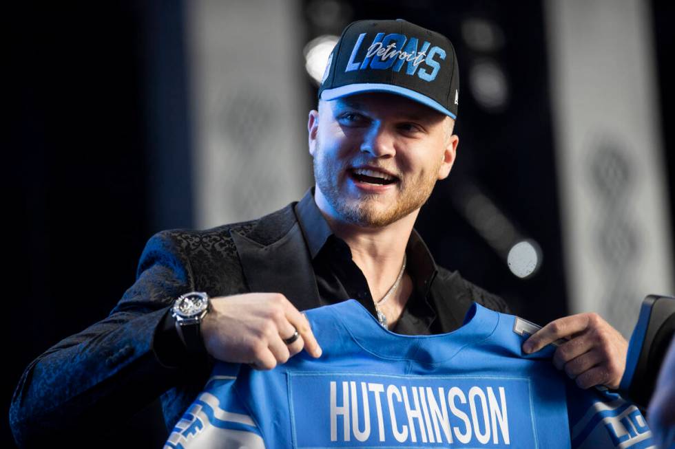 Aidan Hutchinson poses on stage after the Detroit Lions selected him as the second pick in the ...