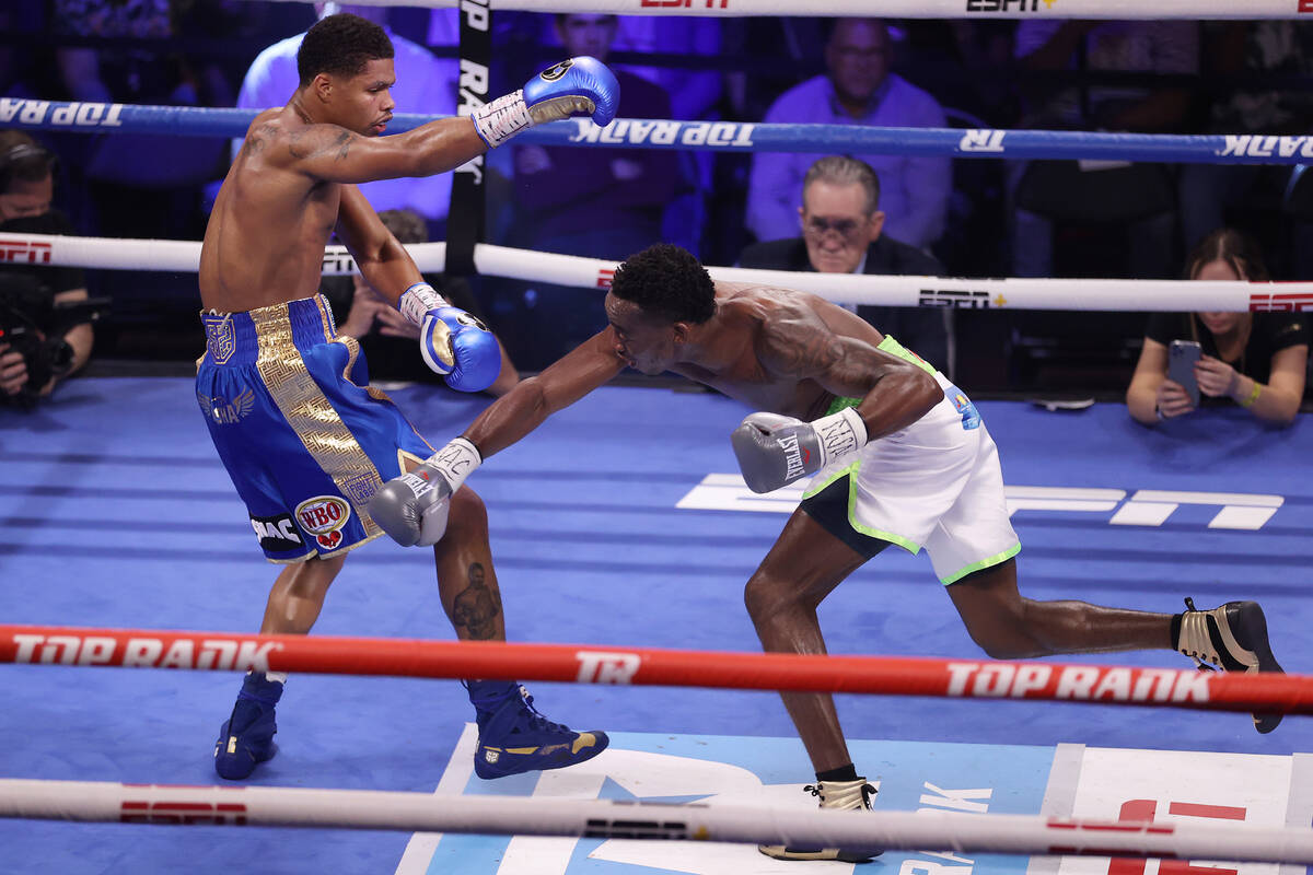 Shakur Stevenson, left, moves away from a punch from Jeremiah Nakathila, in the fourth round of ...