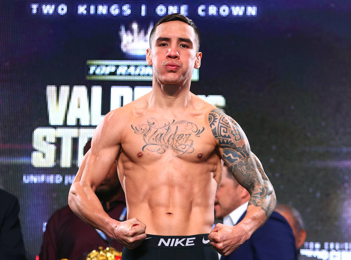 LAS VEGAS, NEVADA - APRIL 29: Oscar Valdez flexes on the scale during the weigh in with Shakur ...