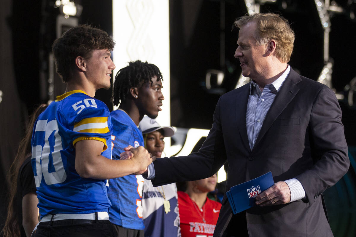 NFL Commissioner Roger Goodell greets a group of local Clark County high school football player ...