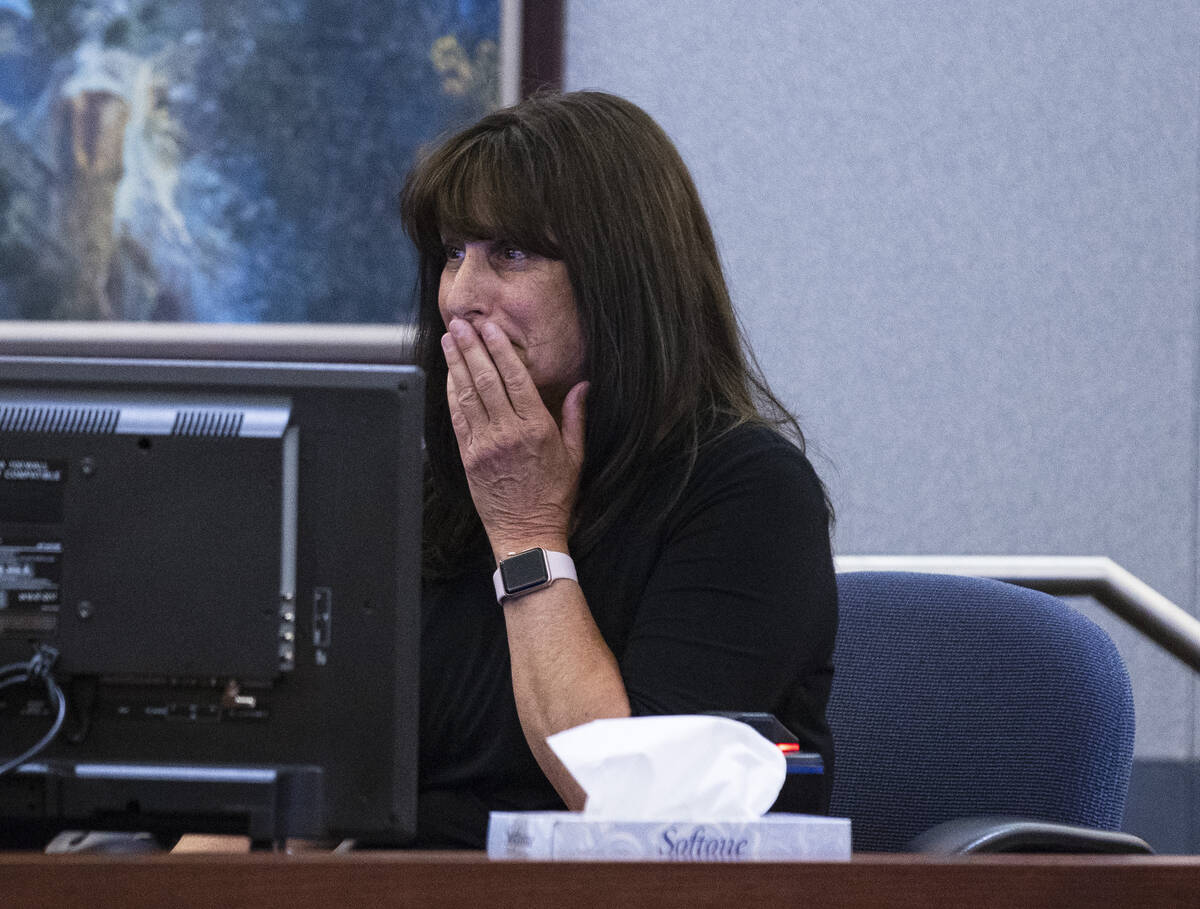 Sharon Neville, the mother of shooting victim Metro officer Shay Mikalonis, weeps as she delive ...