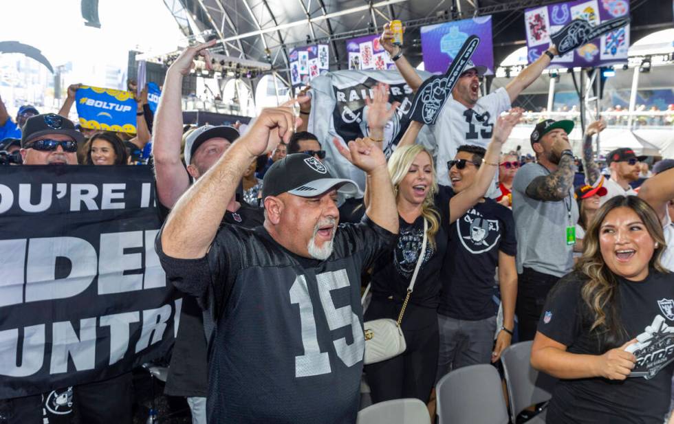 Raiders fans cheer at the Draft Theater during the second day selections for the 2022 NFL draft ...