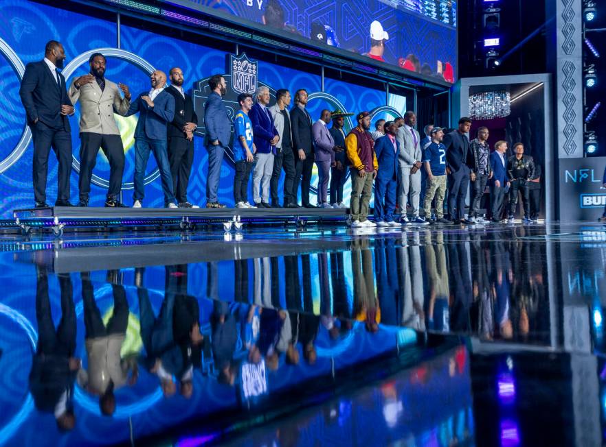 Draft team selection announcers gather on stage at the Draft Theater during the second day sele ...