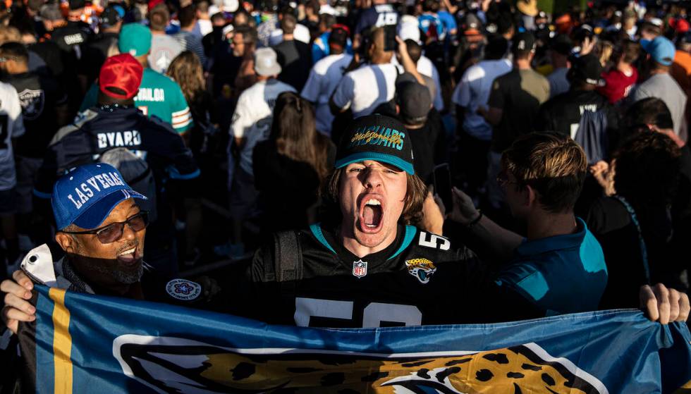 Hayden Coddington, from Jacksonville, Fla., cheers for the Jaguars during day two of the NFL dr ...