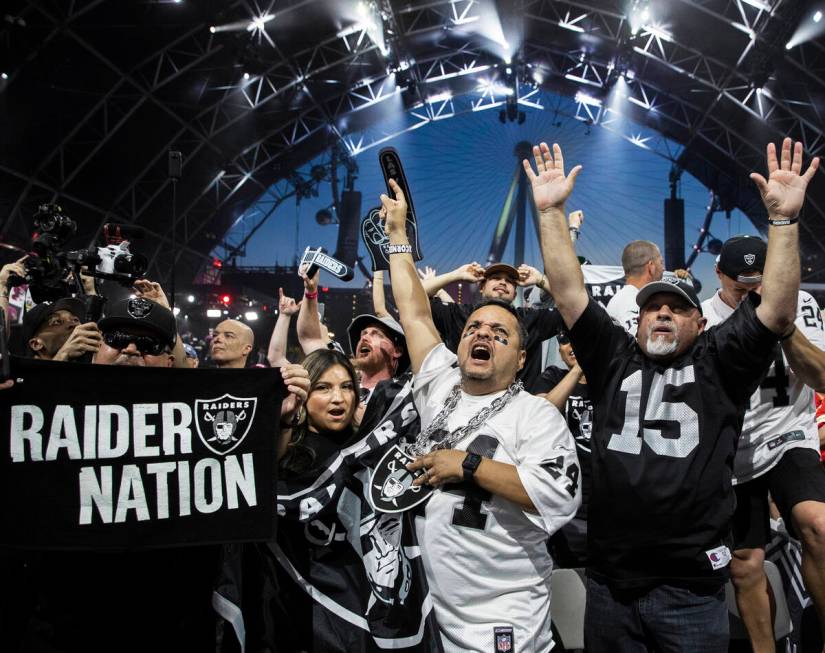 Raiders fans erupt after Las Vegas made their first pick of the 2022 NFL draft on Friday, April ...