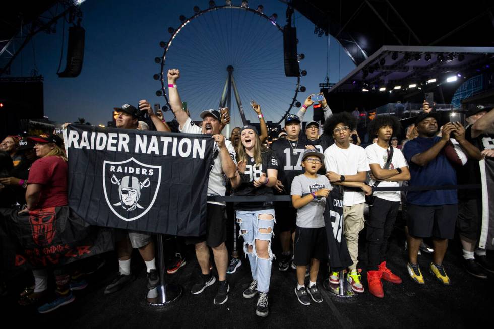 Fans cheer during the Las Vegas Raiders 90th overall pick selection during the second day of th ...