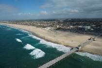 The pier and shoreline is seen in Huntington Beach, Calif., in October 2021. (AP Photo/Ringo H. ...