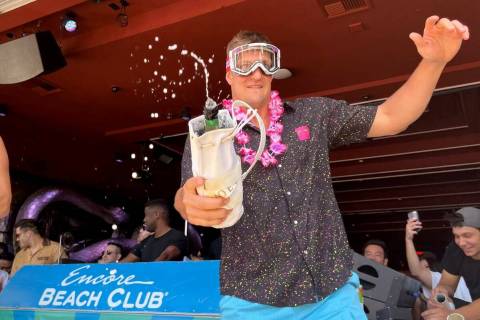 Rob Gronkowski sprays sparkling wine on the crowd during Gronk Beach party at Encore Beach Club ...