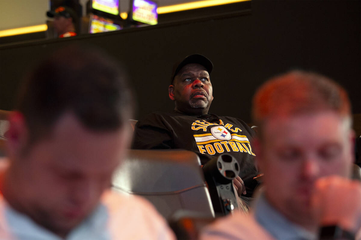 Pittsburgh Steelers fan Dwayne Wyatt, of California, watches NFL football draft coverage at Cir ...