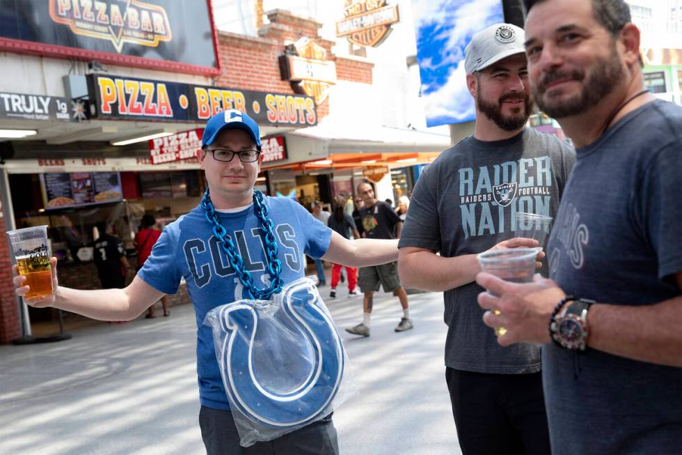 Jake Kline, of Missouri, shows off his new Indianapolis Colts chain at Fremont Street Experienc ...