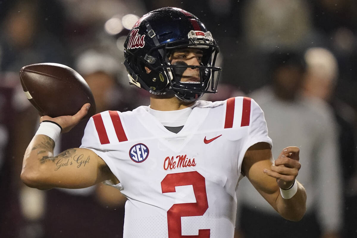 FILE - Mississippi quarterback Matt Corral (2) passes against Mississippi State during the firs ...