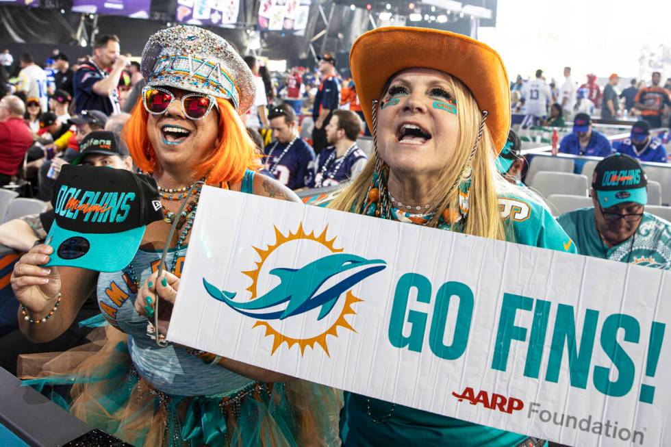 Miami Dolphins fans Mirta Cordoves, right, and Jen Schultz, from Miami, Fla., during day two of ...