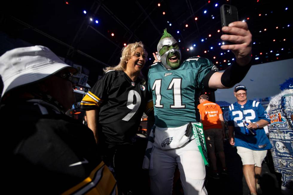 Fans record a video on a cellphone during the second day of the NFL Draft event in Las Vegas, F ...