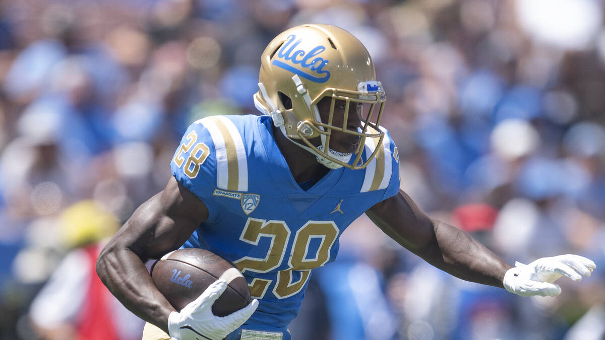 UCLA running back Brittain Brown (28) sprints with the ball during an NCAA football game agains ...