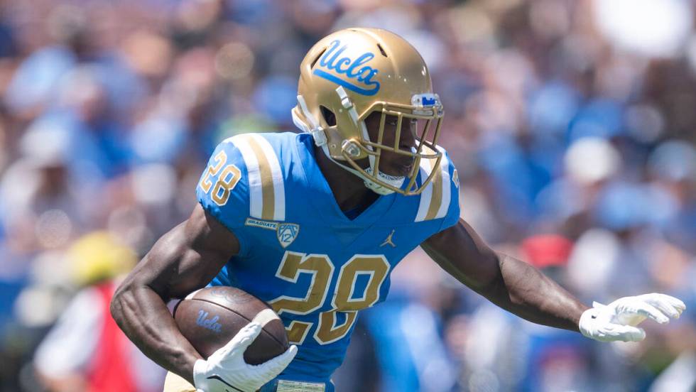 UCLA running back Brittain Brown (28) sprints with the ball during an NCAA football game agains ...
