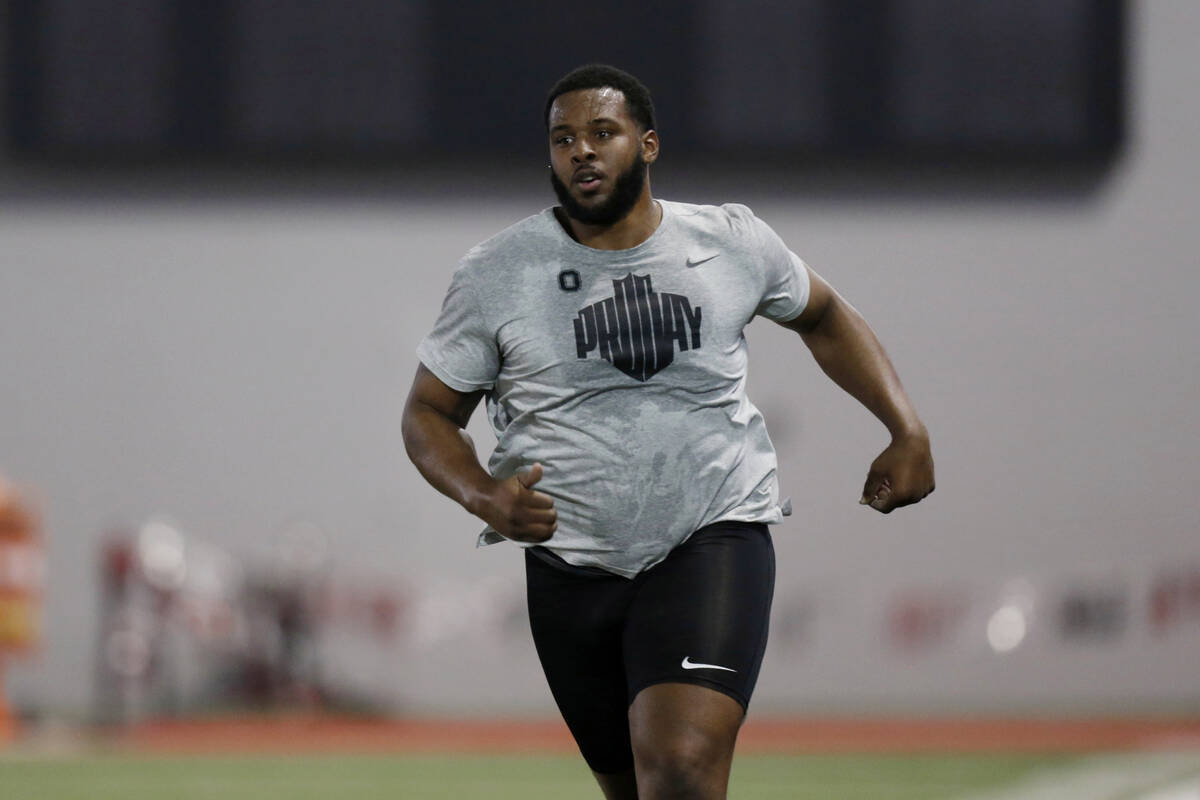 Tackle Thayer Munford runs a football drill during Ohio State Pro Day in Columbus, Ohio, Wednes ...