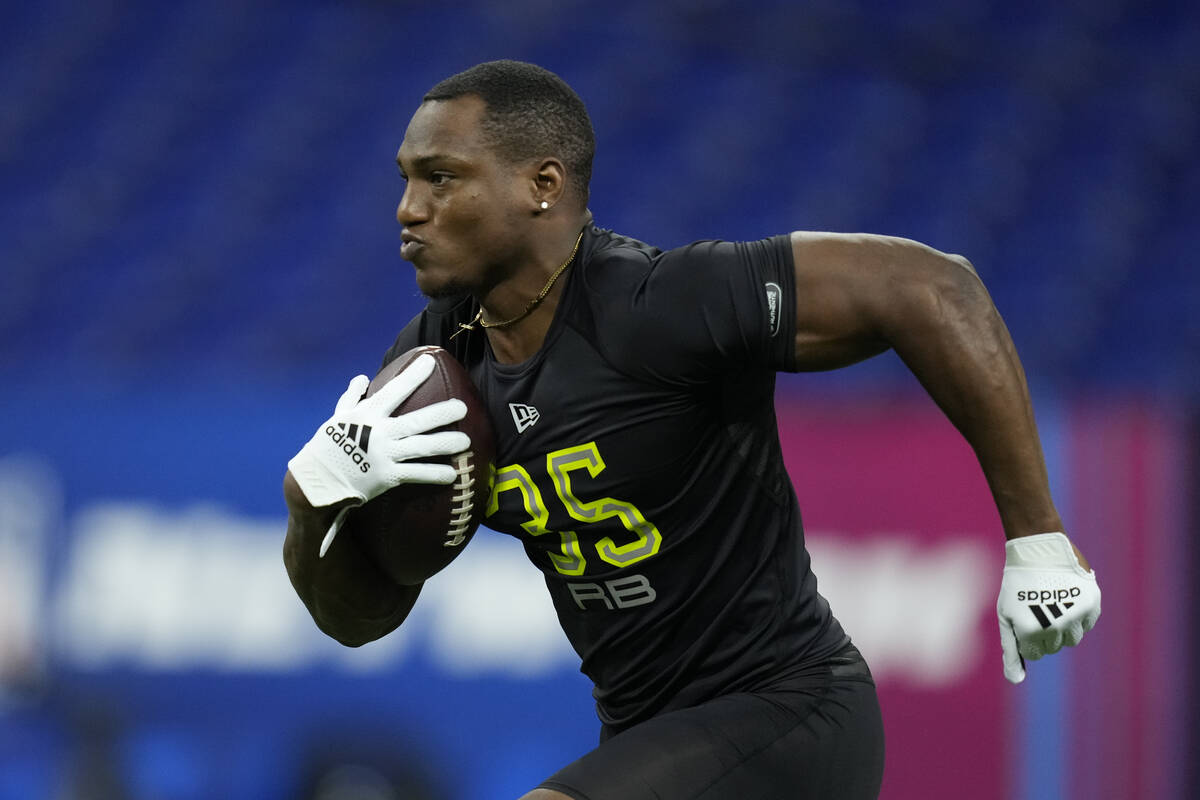 Georgia running back Zamir White participates in a drill at the NFL football scouting combine i ...