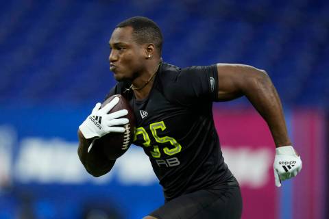 Georgia running back Zamir White participates in a drill at the NFL football scouting combine i ...