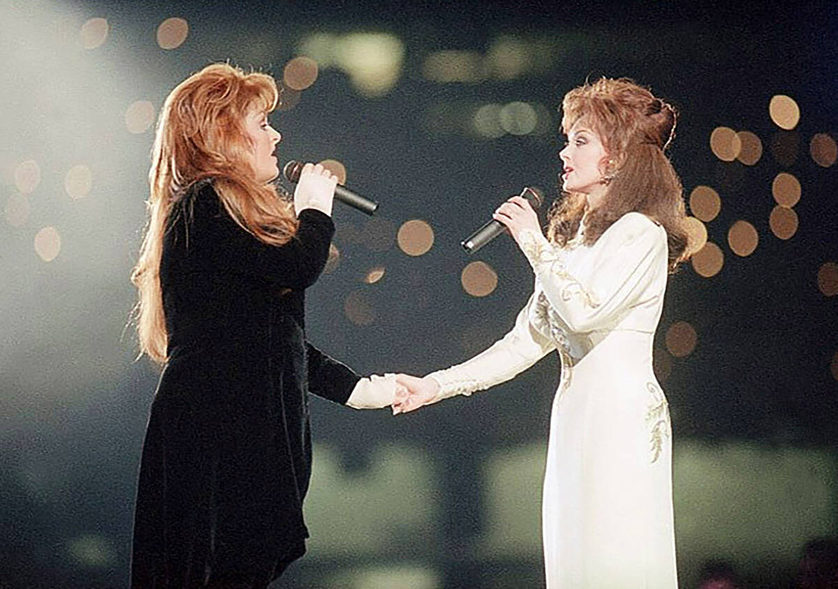 FILE - Wynonna Judd, left, and her mother, Naomi Judd, of The Judds, perform during the halftim ...
