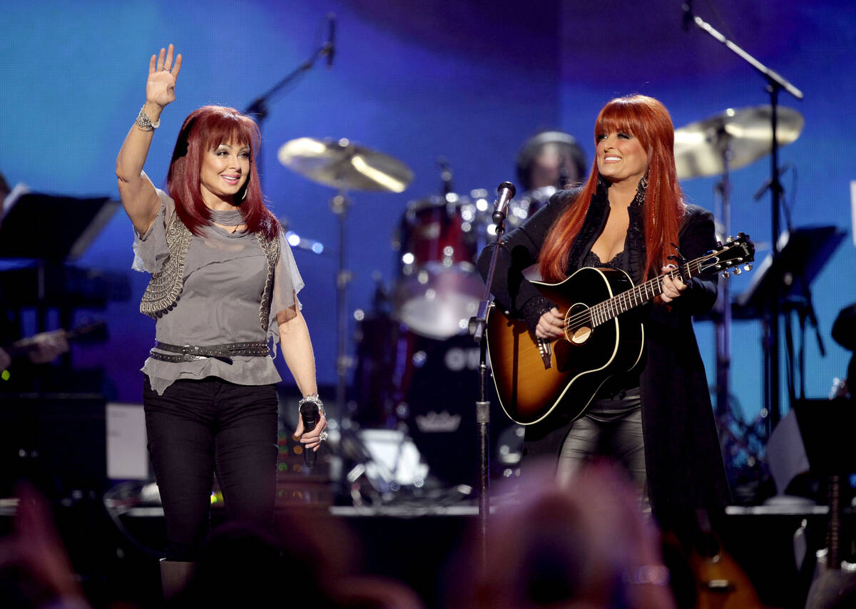 FILE - Naomi Judd, left, and Wynonna Judd, of The Judds, perform at the "Girls' Night Out: ...