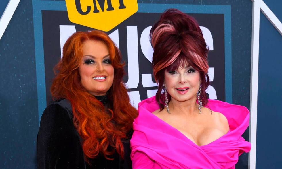 FILE - Wynonna Judd, left, and Naomi Judd arrive at the CMT Music Awards on Monday, April 11, 2 ...