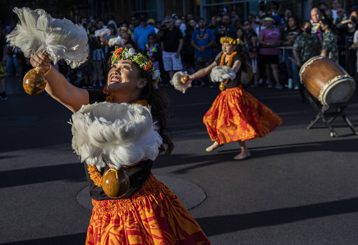 Kalei Gonzales, left, dances during Lei Day, a new parade to celebrate and kick off Asian Pacif ...