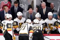 Vegas Golden Knights head coach Peter DeBoer, center, talks to players during the third period ...