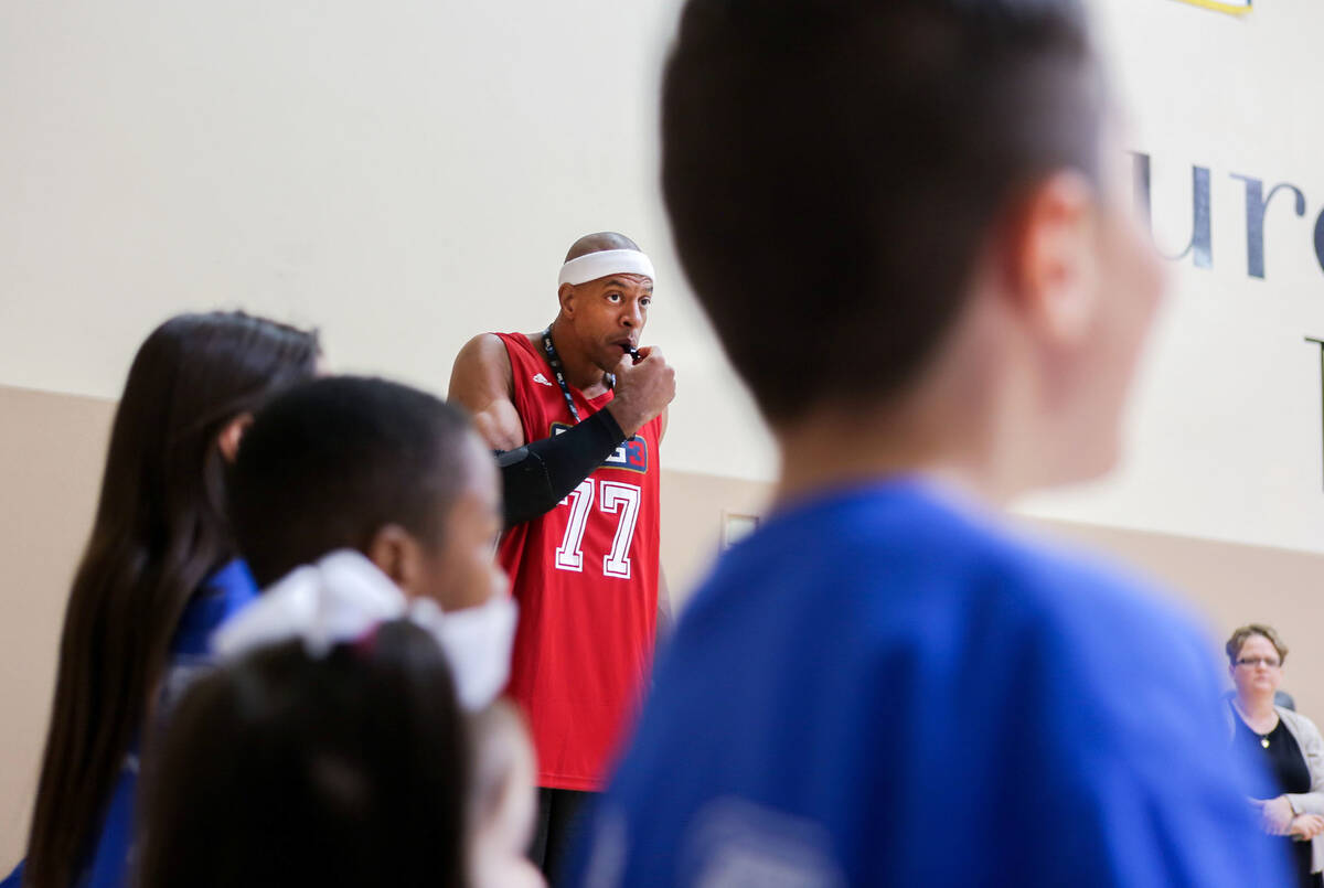 Former NBA player Jerome "Junkyard Dog" Williams leads drills for kids participating in the Cen ...