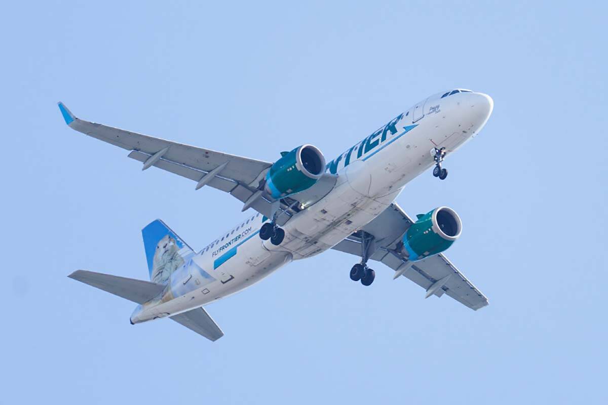 A Frontier Airlines aircraft flying over Gloster City, N.J., approaches Philadelphia Internatio ...