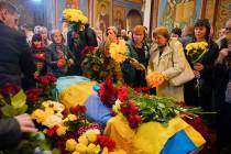 People pay their respects during the funeral ceremony for Ukrainian serviceman Ruslan Borovyk k ...