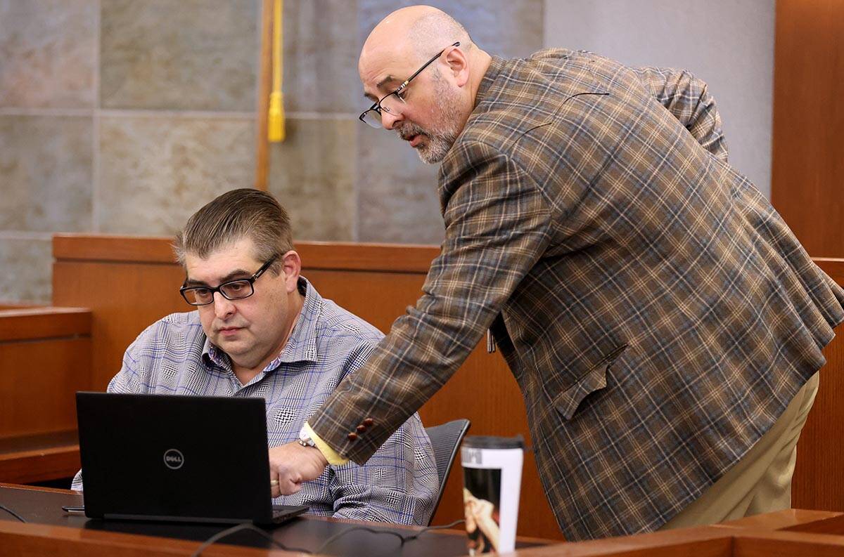 Prosecutor Bernard Zadrowski shows surveillance video to Robert Alexander on the witness stand ...