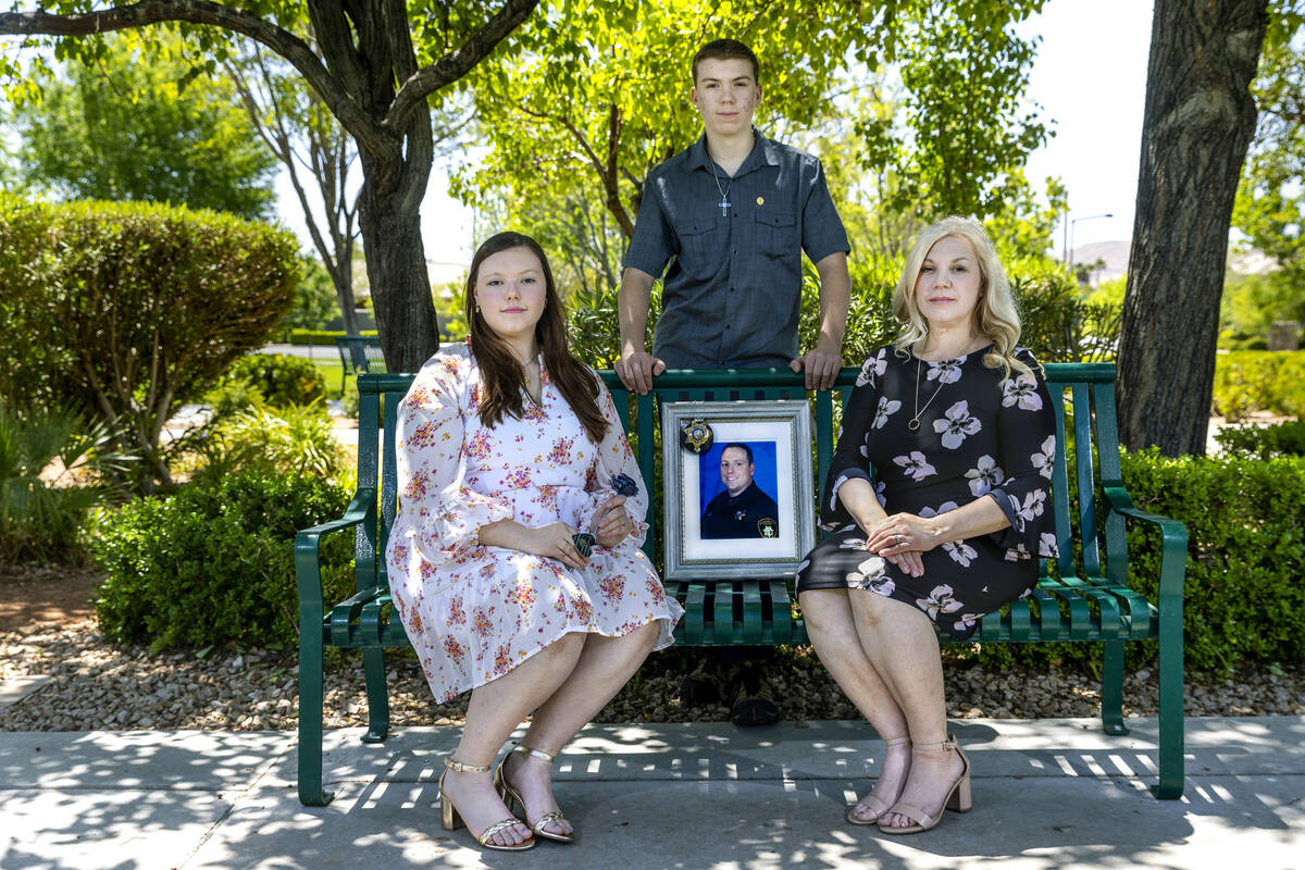 Jenn Closi, right, along with her children, Nicola, 17, and Jacob, 15, pose with a photo of her ...