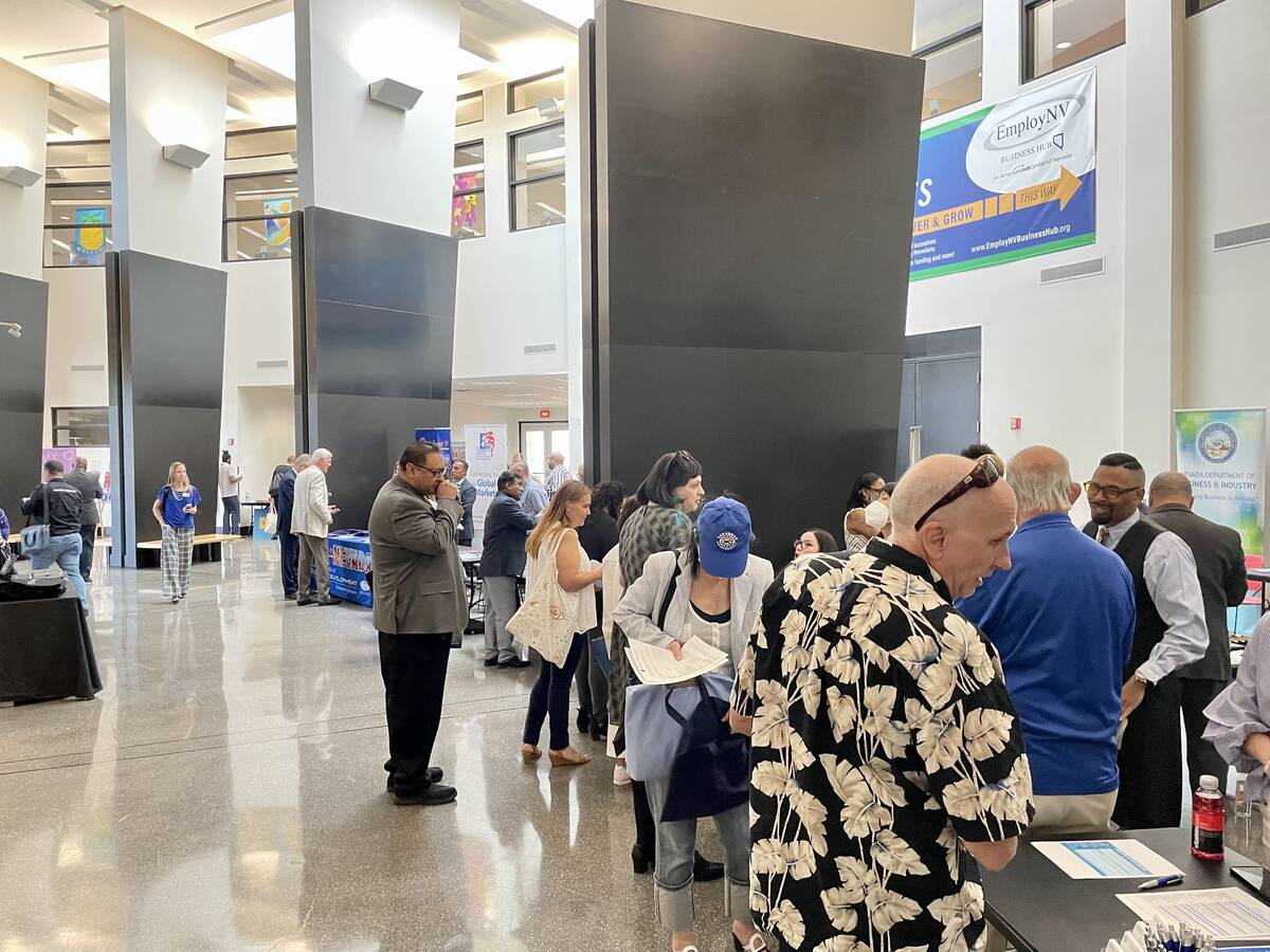 People walk around the Small Business Resource Fair on Wednesday, May 4, 2022, at the Sahara We ...