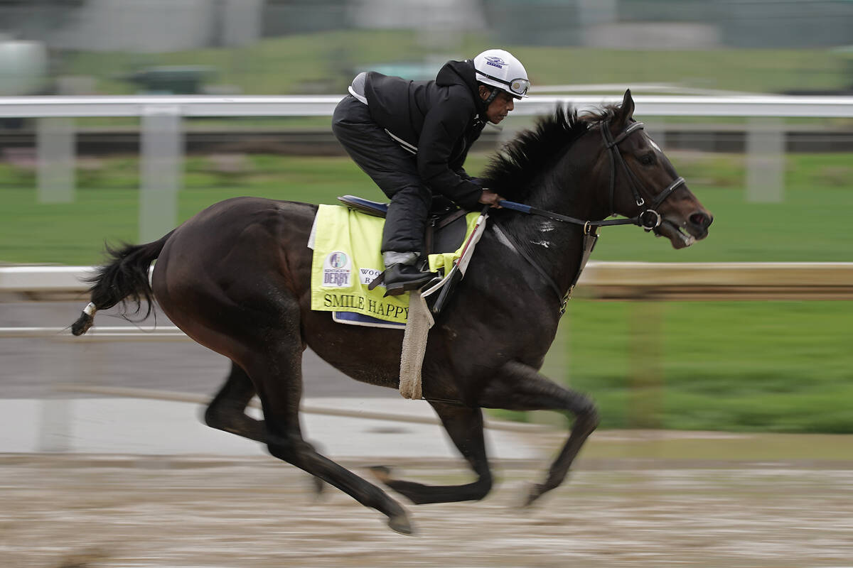 Kentucky Derby entrant Smile Happy works out at Churchill Downs Tuesday, May 3, 2022, in Louisv ...