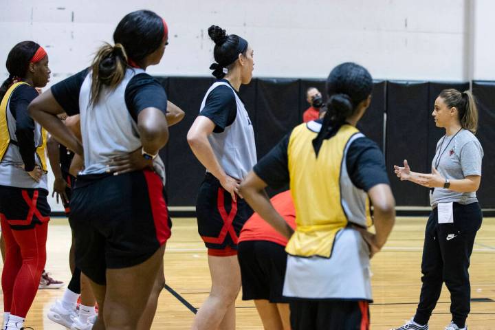 Las Vegas Aces head coach Becky Hammon speaks to her player after team’s practice at the ...